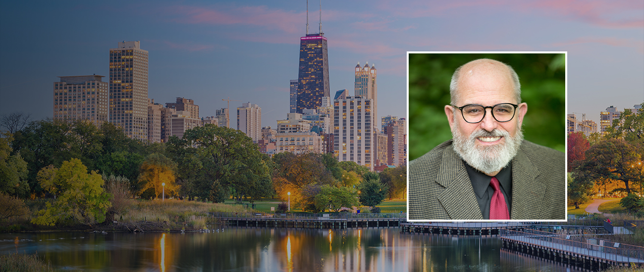 Desktop-Banner-A-panoramic-view-of-Chicago-skyline-overlaid-with-a-portrait-of-Alan-E-Jones.jpg