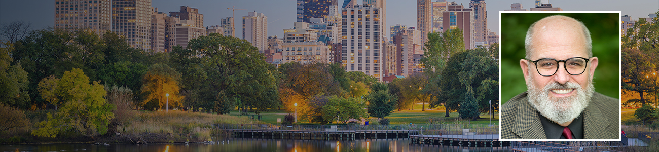 Internal-Desktop-Banner-A-panoramic-view-of-Chicago-skyline-overlaid-with-a-portrait-of-Alan-E-Jones.jpg